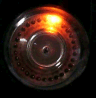 Figure 5 — 5 — A dekatron in operation: the glow parked on one cathode of the 0–9 ring — the "spinning dot" that gives these tubes their charm (animated). Photo: Dieter Waechter, via Wikimedia Common…